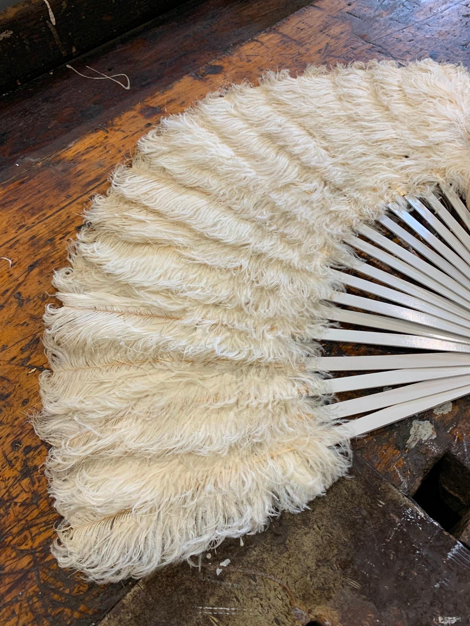 Antique Cream Ostrich Plume Evening Folding Hand Fan: Painted winter white wood sticks, feathers remain lush, brass bail, bone tipped pin, 14 1/2" x 20".