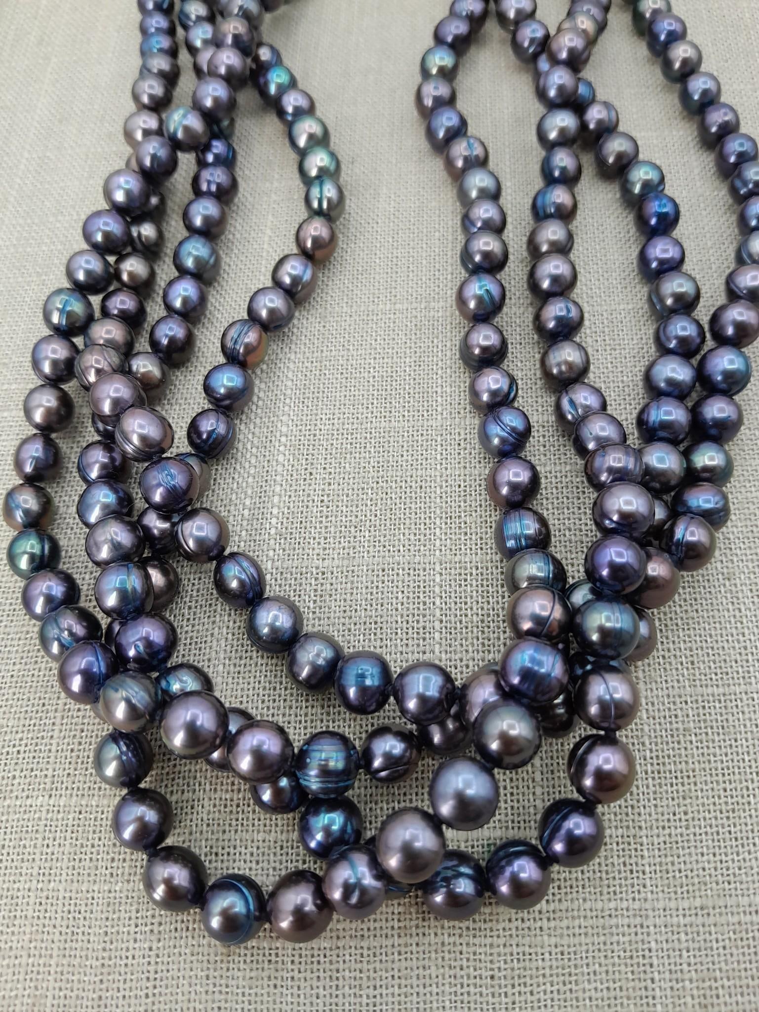 Incredible 80" Ringed Round Single Strand Peacock Pearl Necklace: Outstanding hue, hand knotted, 8mm size pearls, rings/circle ridges on many of the pearls.