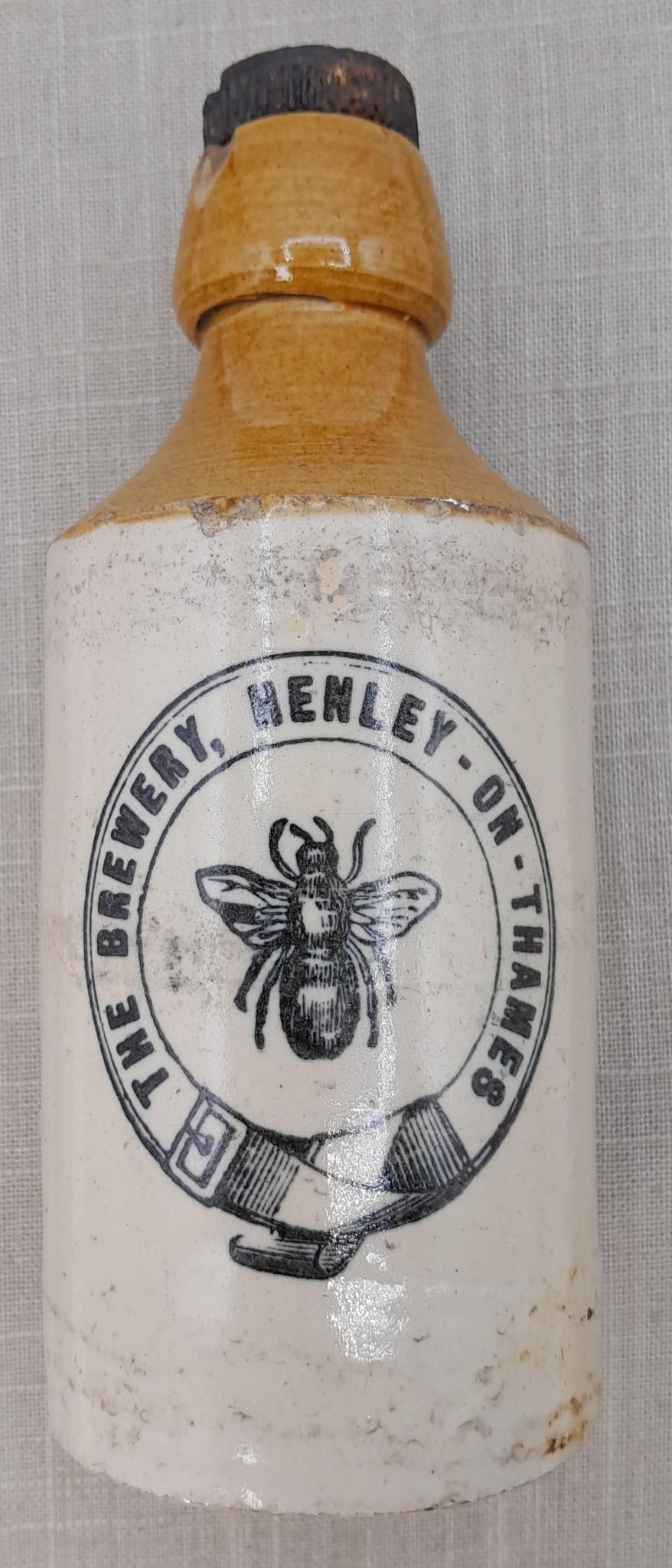 Early English Stoneware Beer Bottle: The Brewery Henley on Thames: 7 1/8", old nip on mouth and cap, Bourne Denby impressed maker mark.