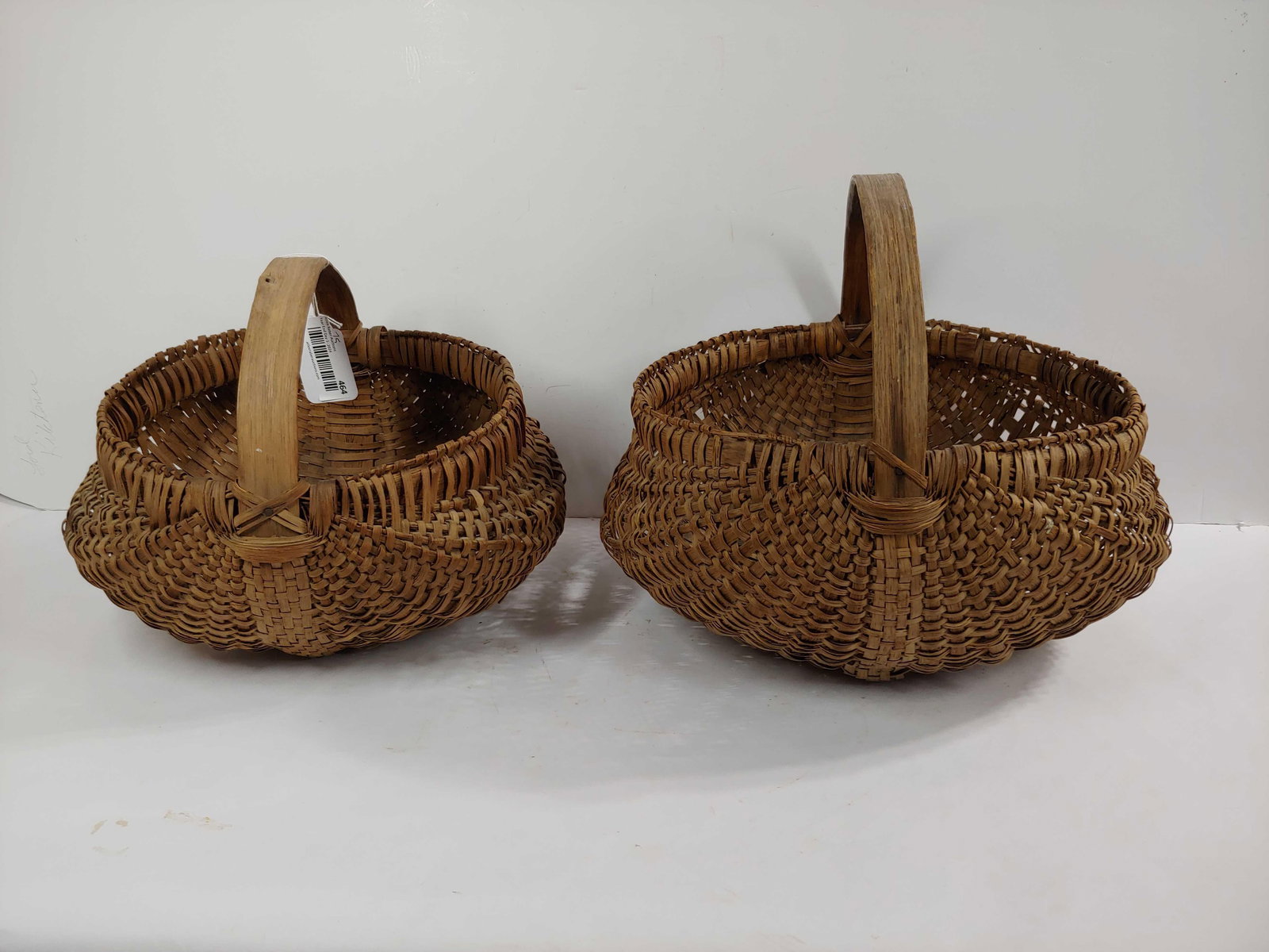 PRIMITIVE HAND WOVEN SPLINT HANDLED BUTTOCKS BASKETS LOT OF 2 (1 of 9)