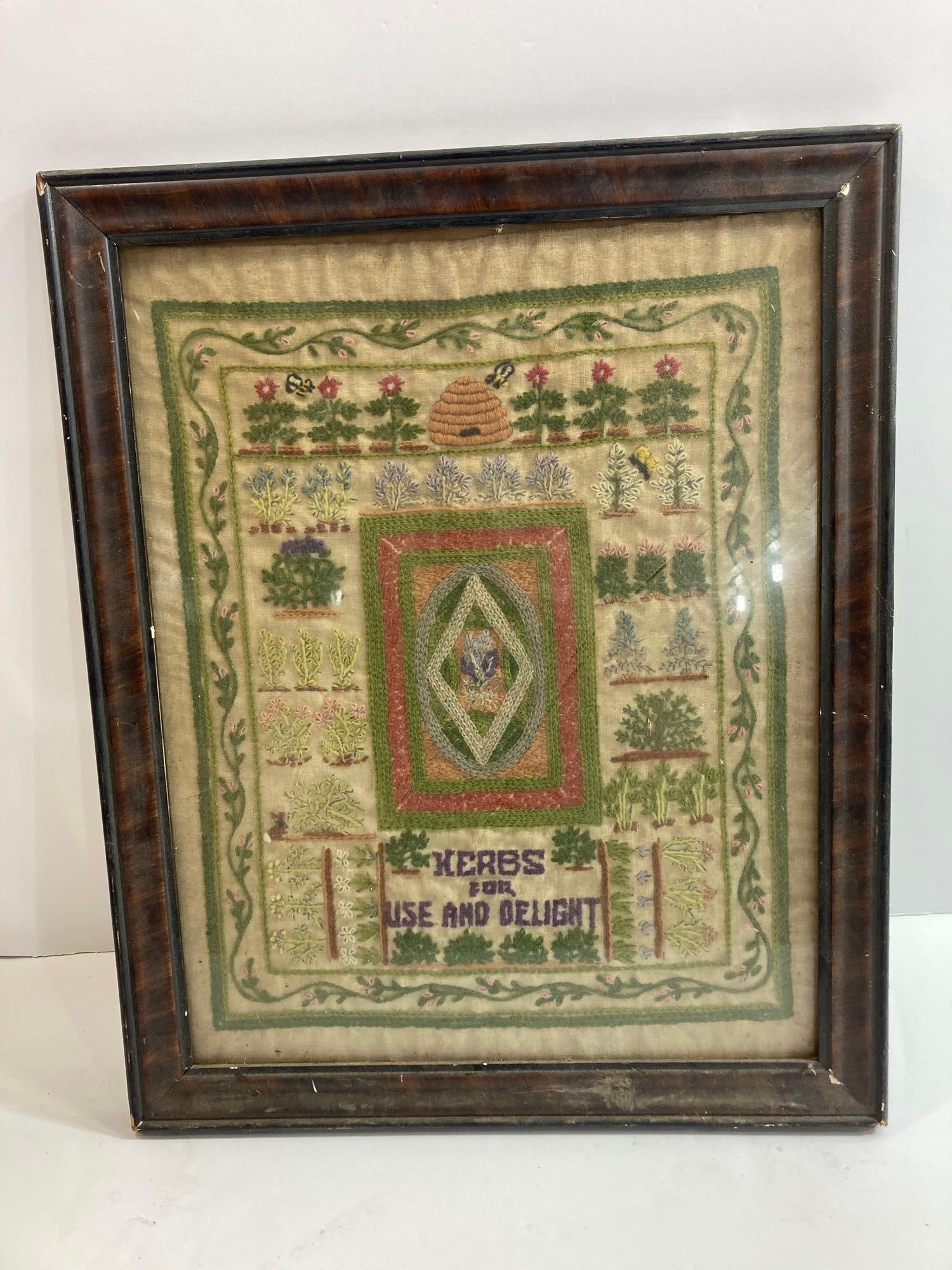 Early Herbs Sampler: With hand writing on cardboard backer that states My Mom stitched this sampler Irene Irma Kinieak. 17.5in x 21.5in framed.