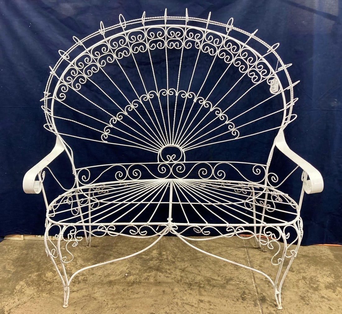 Wrought iron Peacock tail Settee: 49in wide from handle to handle, seat height is 18in overall height is 51in.