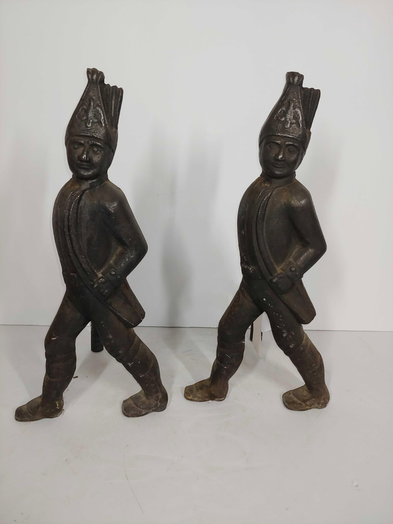 Hessian Cast Iron And Irons: 20 inches tall.