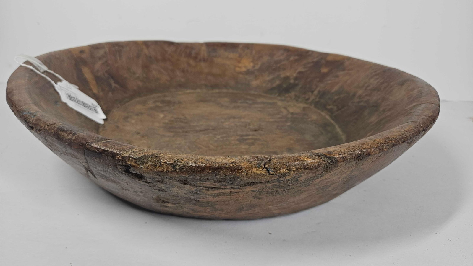 Hand Hewn and wedged Primitive harvest bowl: Multi wood bowl, several wedged pieces were added to this bowl to make it hefty functional piece. Approx 18 in diameter
