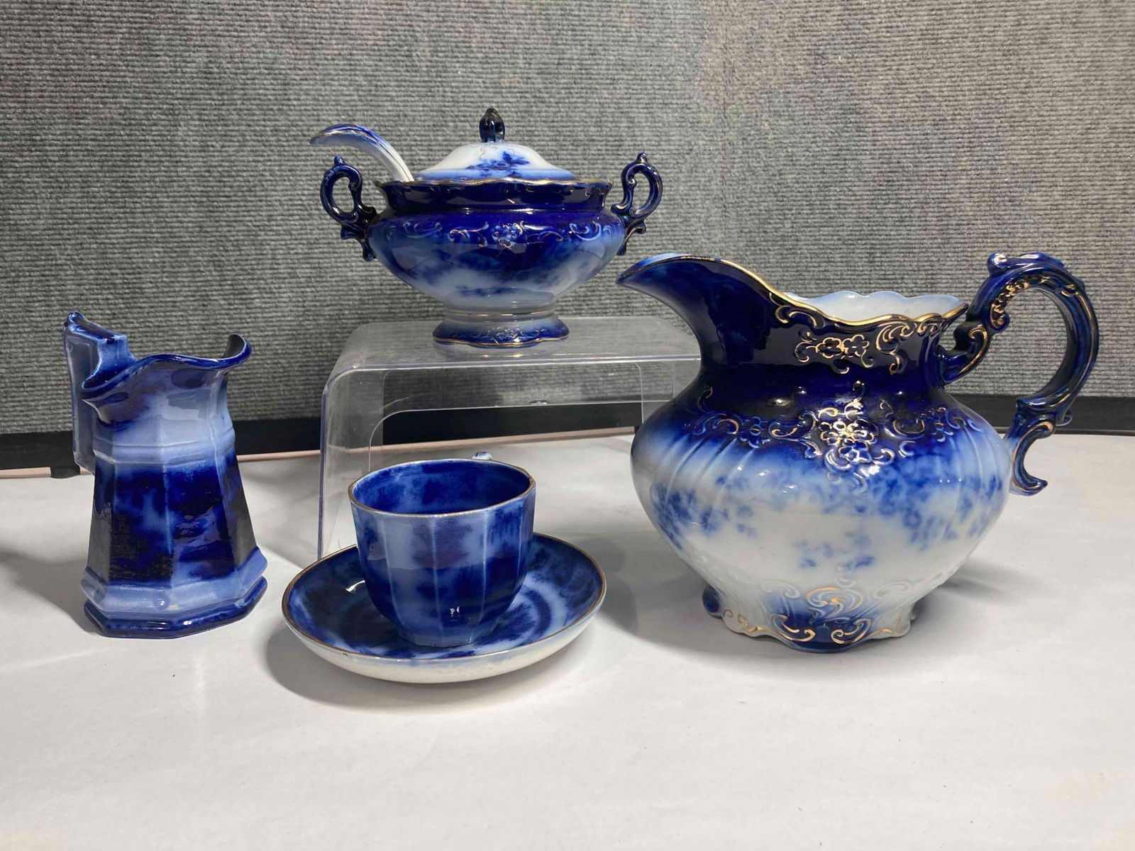 Flow Blue Tureen, pitcher, mug and saucer, and creamer (1 of 14)