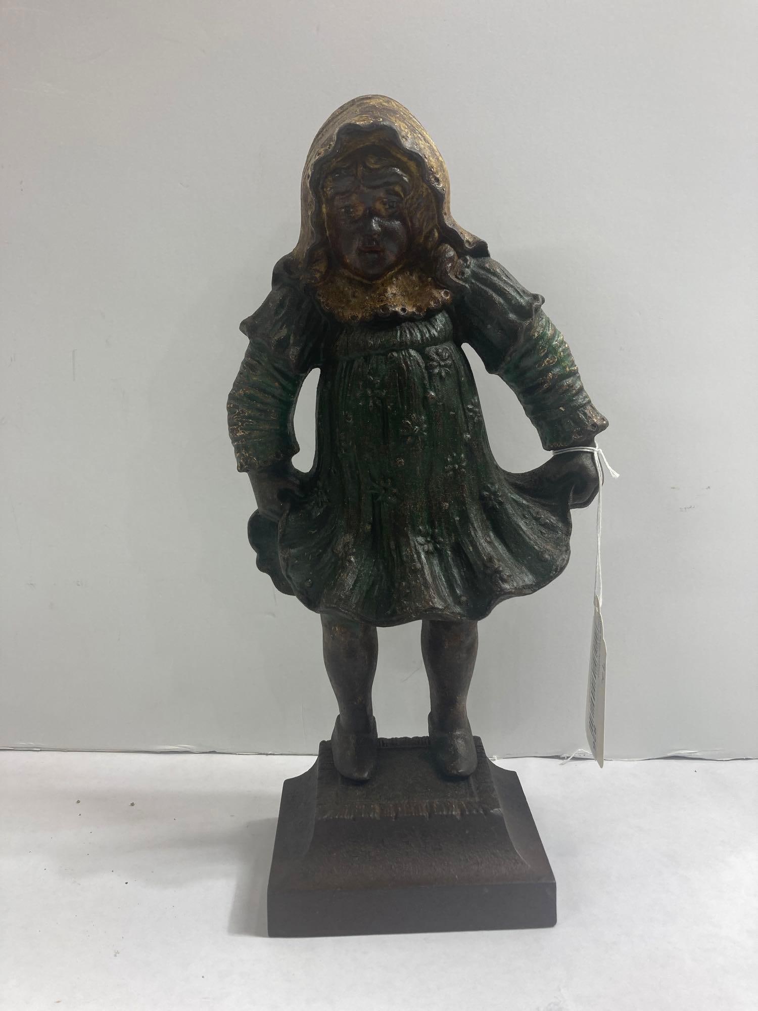 Extremely Rare Bradley & Hubbard cast iron door stop: #4 of Bradley & Hubbards rarest doorstops!! Beautiful example of "Girl Holding Dress" in original paint and in great condition! Circa 1900-35. 13in tall.