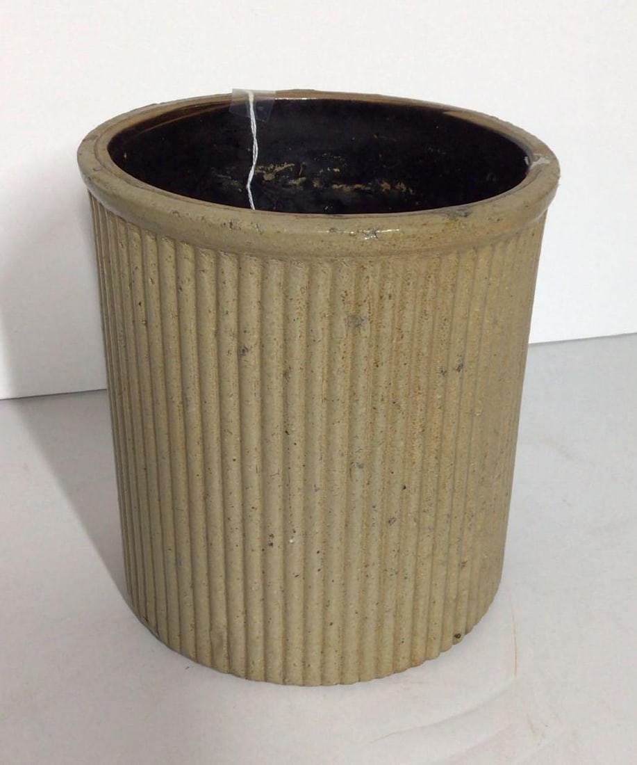 J.Swank & Co. ribbed 1-gal stoneware jar: With a few minor flakes on base and rim but overall is in good condition! No cracks! 7in diameter 8in tall.