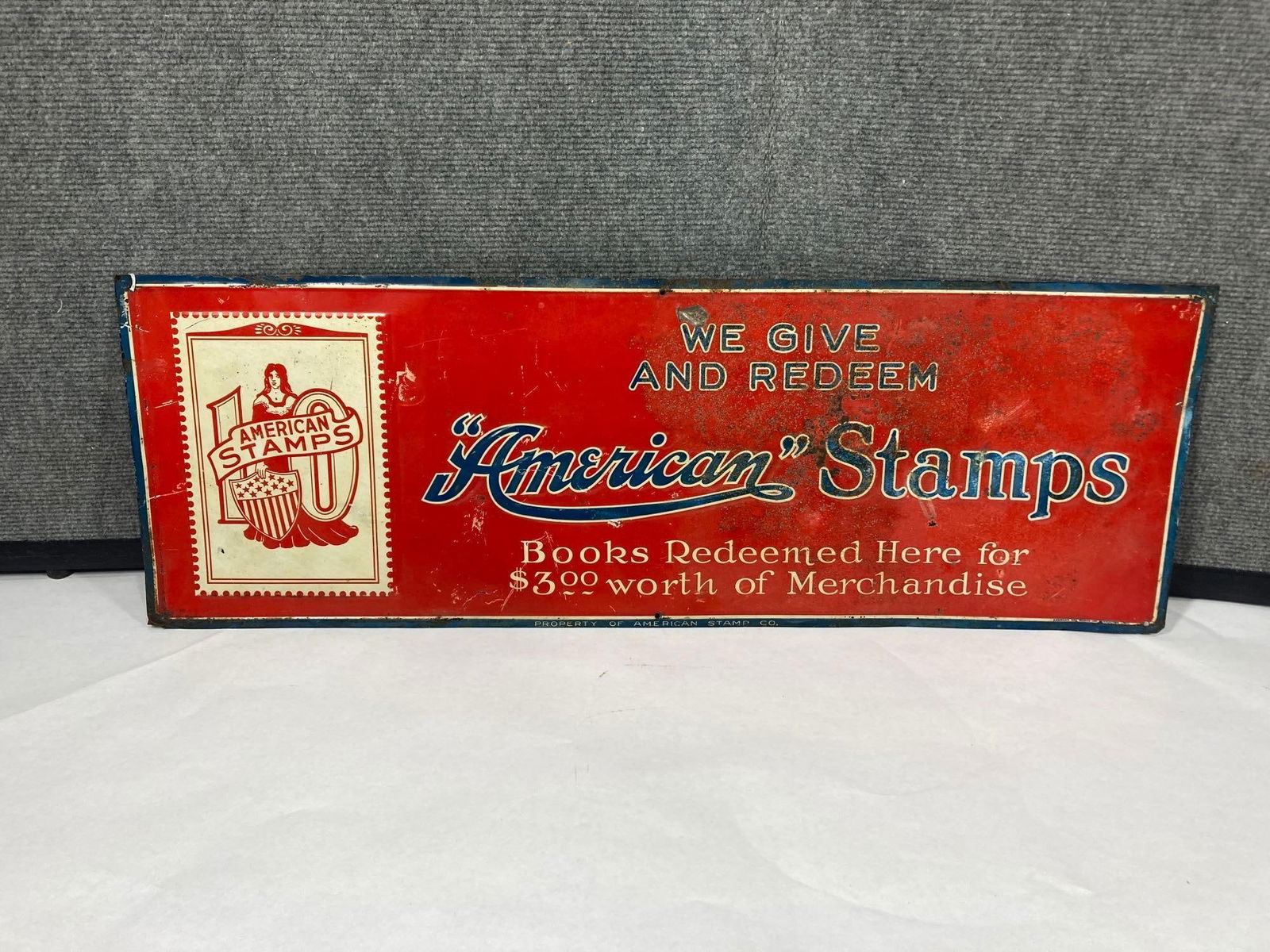 AMERICAN STAMP CO. SST TIN TACKER BY AMERICAN ART WORKS EMBOSSED (1 of 5)