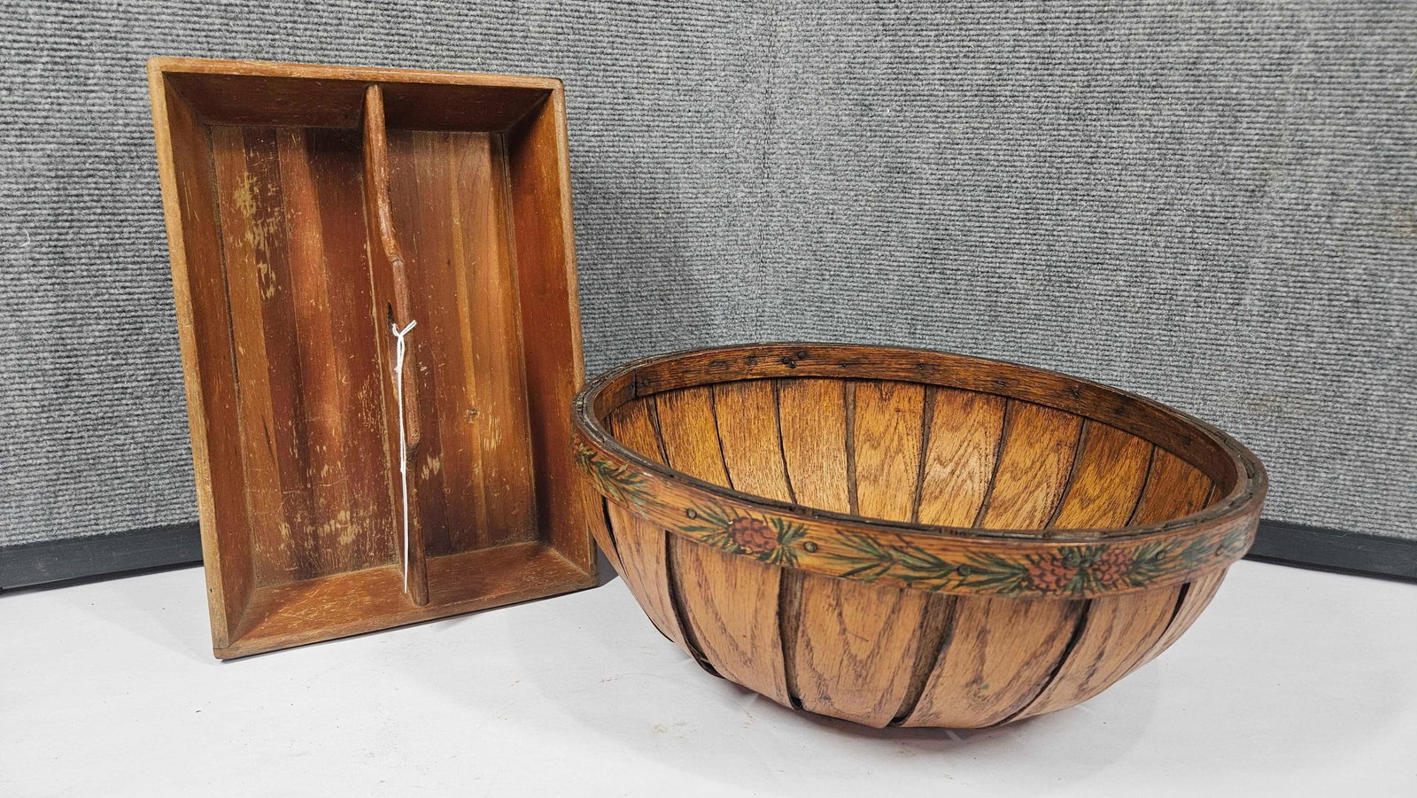 SPRUCE TREE DECORATED BASKET AND CADDY: BASKET FEATURES EVERGREEN AND PINECONE PAINTED DETAIL AROUND UPPER RIM. 14 INCH DIAMETER. CADDY IS SECTIONED. 12X8