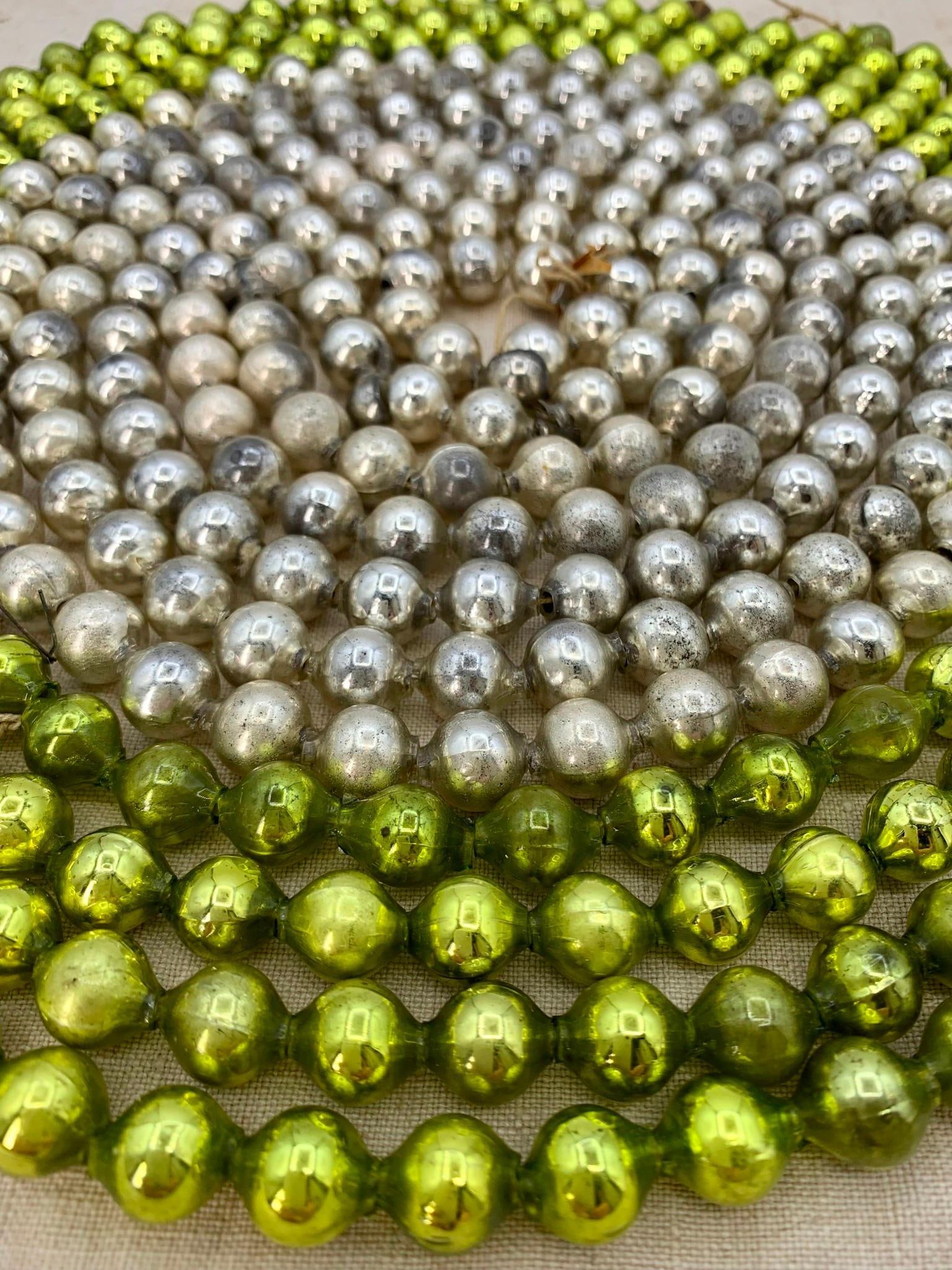 Two 8 Foot Vintage Japan Lime Green & Silver Mercury Glass Large Bead Holiday Tree Garland Strands: Luminous shine, some age and wear to the glass, each strand 8' 8" long with 1/2" beads.