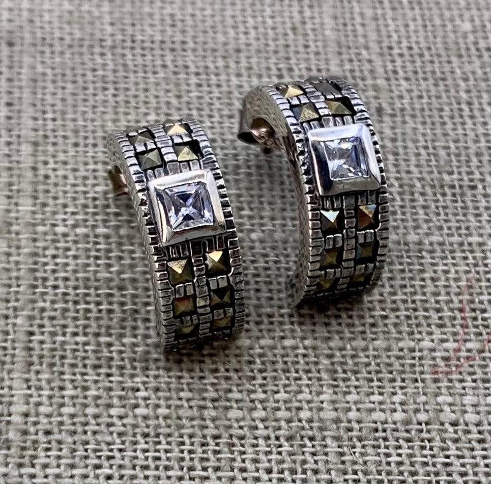 Sterling Silver & Faceted Marcasite Half Hoop Pierced Earrings: Stamped 925, all stones present, 6.2 gram weight, 3/4" X 1/4". 