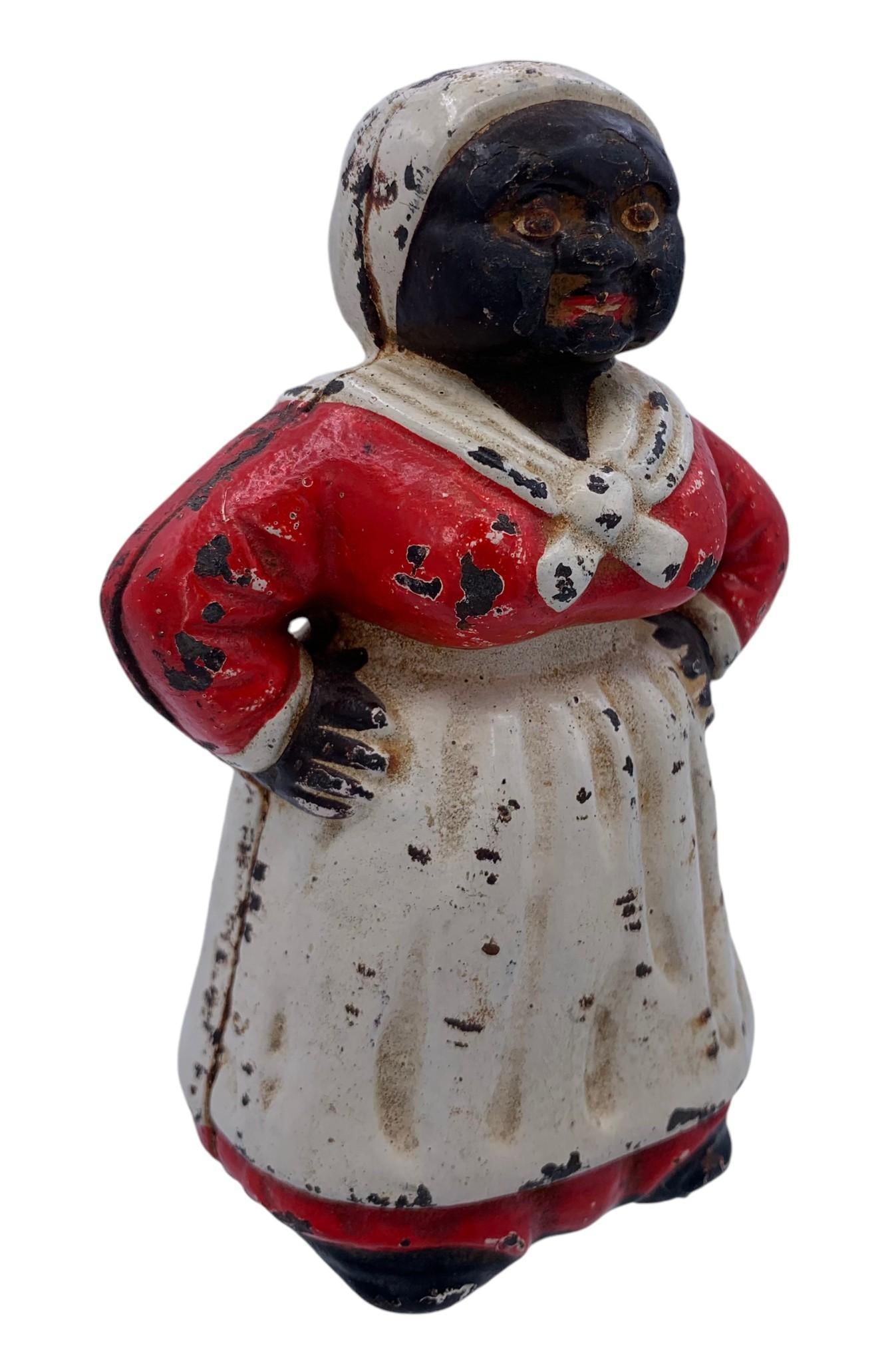 Vintage Black Americana Mammy, Aunt Jemima, Cast Iron Coin Bank, Doorstop: 5 3/4" x 3 3/4" x 2 7/8", old slotted screw construction, wear to the painted iron, weighing 2.25 pounds.