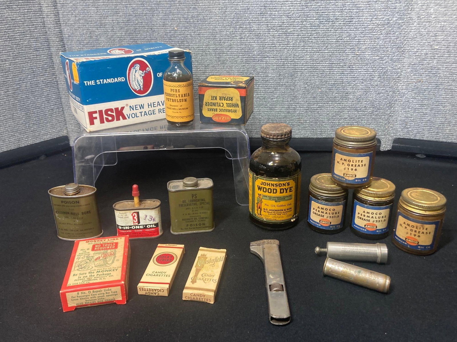 Ammolite, WIzard, Fisk, and other Cleaners and tins: Lucky strike and Chesterfield candy cigarette boxes, monkey link, several gun clean tins, and Fisk voltage regulator