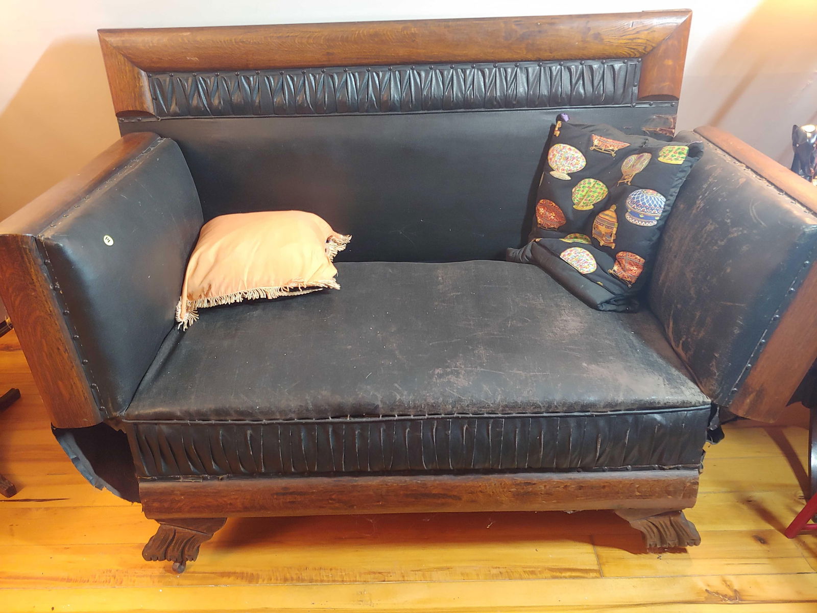 Early Oak Victorian leather chaise lounge: Beautiful Oak lounge fold down side wings and sets on casters!! Leather or vinyl upholstery shows areas of wear but is a piece you don't see everyday!! Back is 42in tall 76in long when wings are l