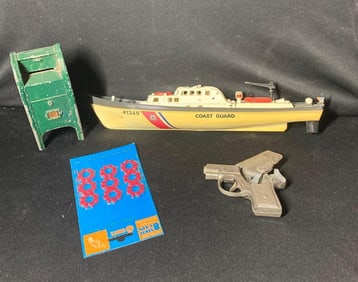 Cast iron coin bank, cap gun and Coast Guard Model Ship