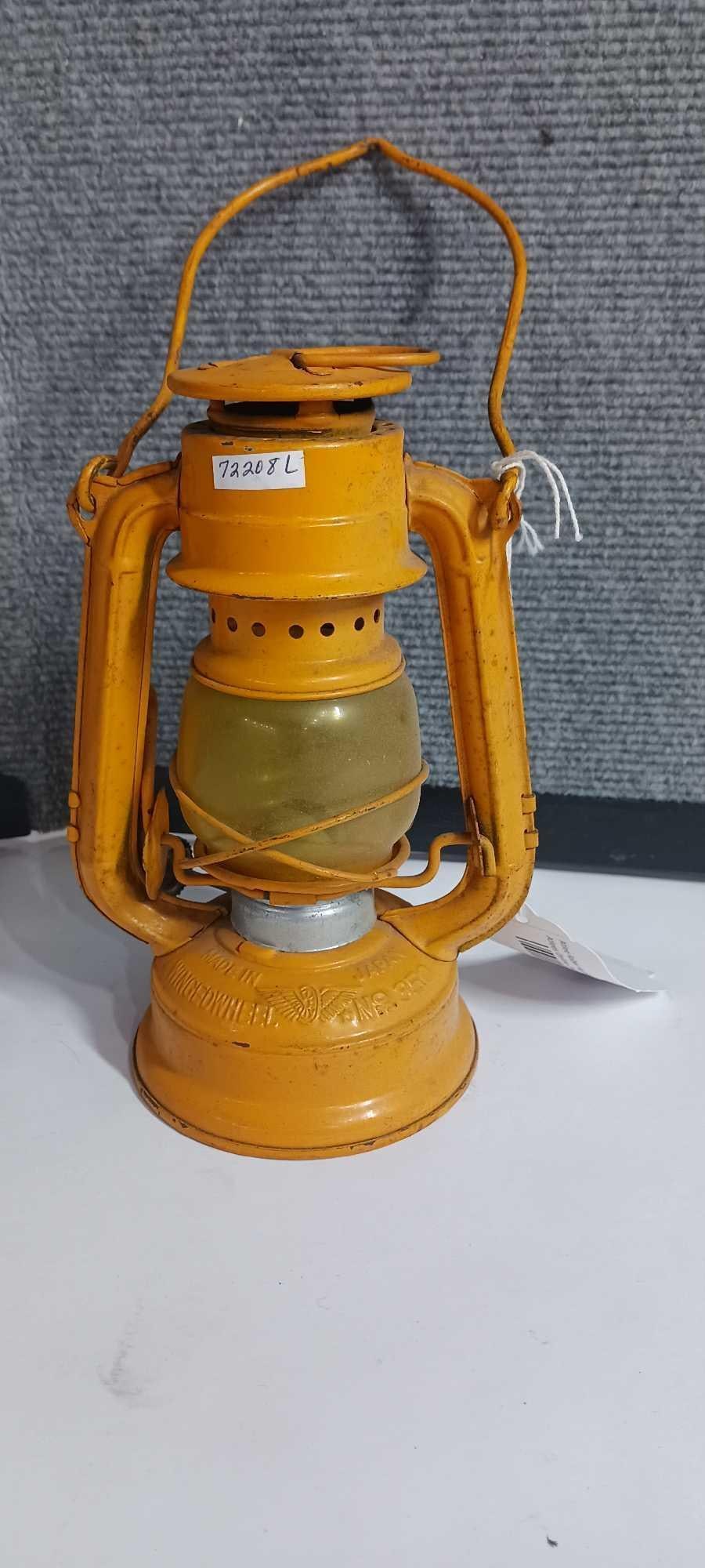 Winged Wheel Yellow lantern No 350: 7.5 inches tall, Yellow glass globe.