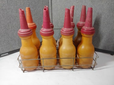 8 plastic Oil Bottles with carrier