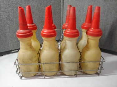 8 plastic Oil Bottles with carrier