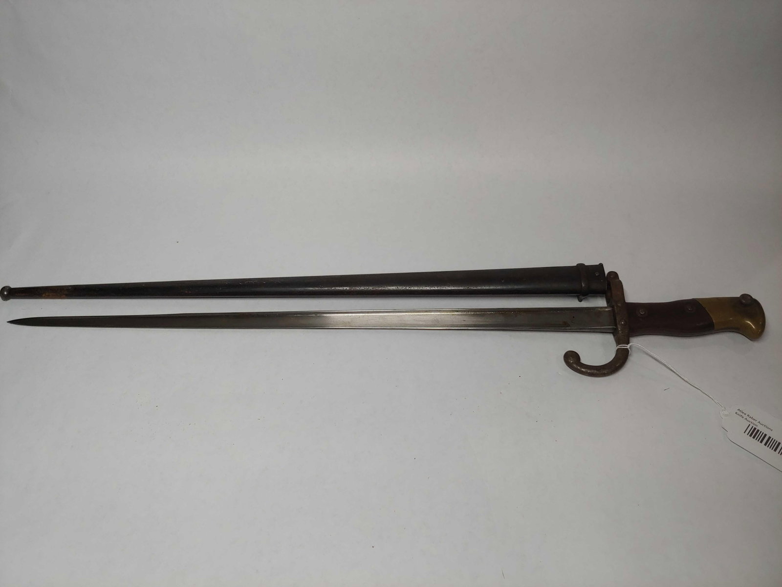 French Etienne Sword Bayonet: Grip marked FG 8288820.5 inch blade. Scabbard included. Blade is etched 1881