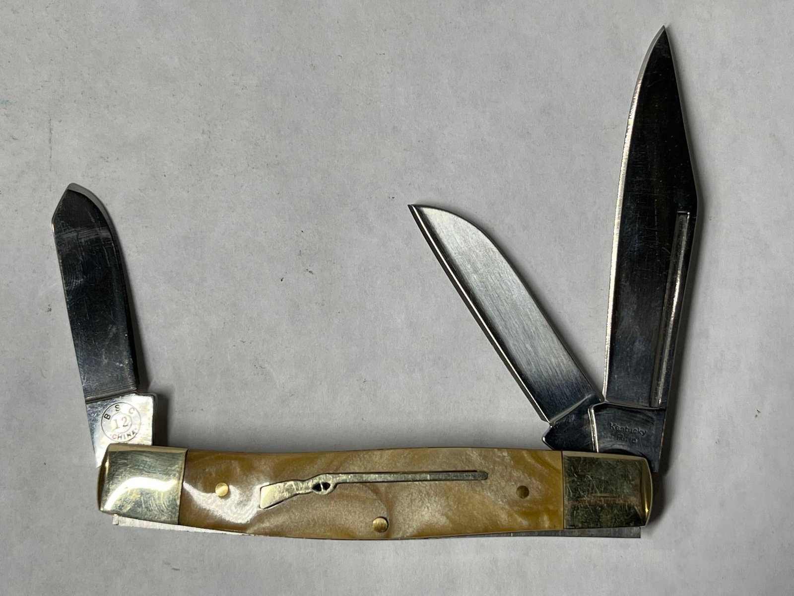 KENTUCKY RIFLE POCKET KNIFE WITH MARBLED HANDLE AND INLAID RIFLE: This awesome Kentucky RIFLE multi tool pocket knife has a 2 75" blade