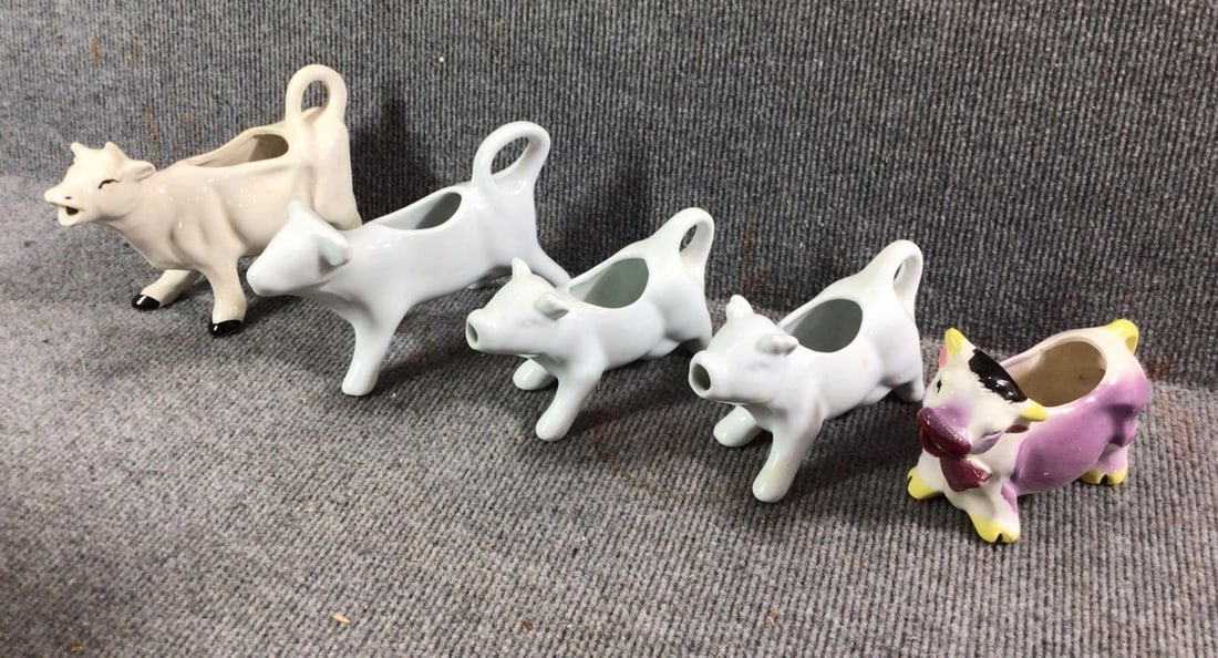 Early Ceramic Creamers: Vintage Japan, and several farmhouse white. All are in good condition. One has a very small hairline on underside of belly.
