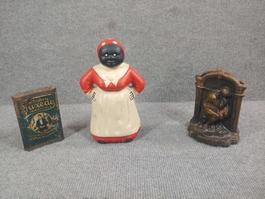 Cast Iron Mammy Bank, Tobacco Tin, and Thinker Bookends
