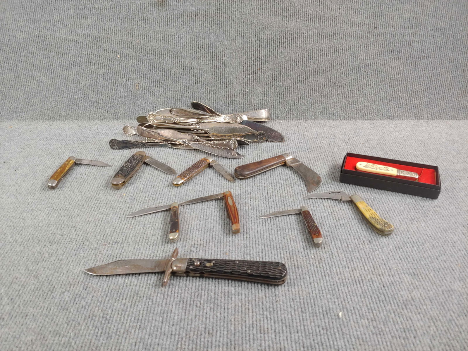 Schrade Scrimshaw and other pocket knives and utensils: Sabre hawkbill knife, Frost Cutlery, Schrade Switchblade, and more. Some butter and cheese knives are silver plated