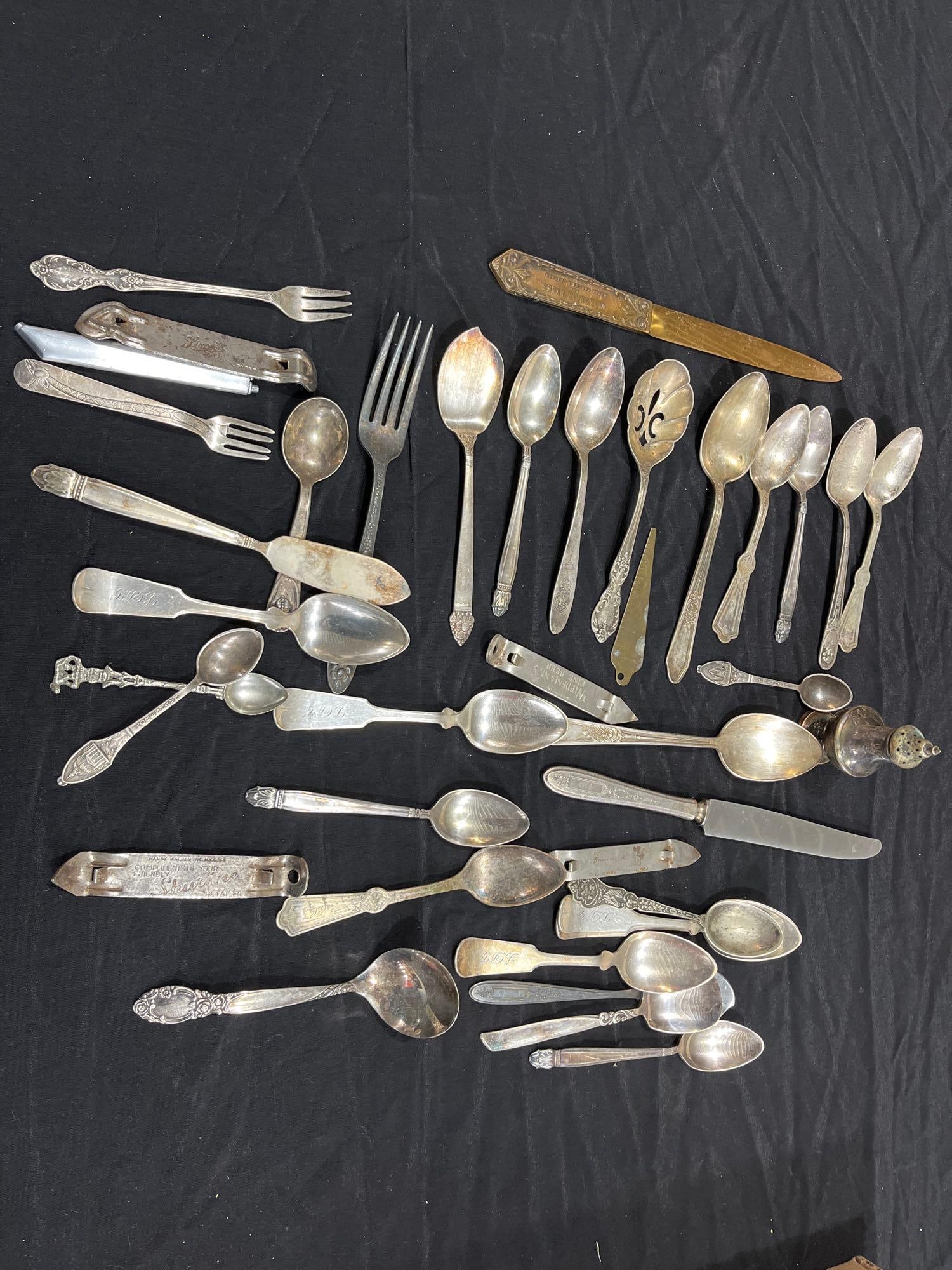 Silver Plated Utensils: Gerber baby spoon, tea spoons, butter knives, and one shaker. Most are silver plated.