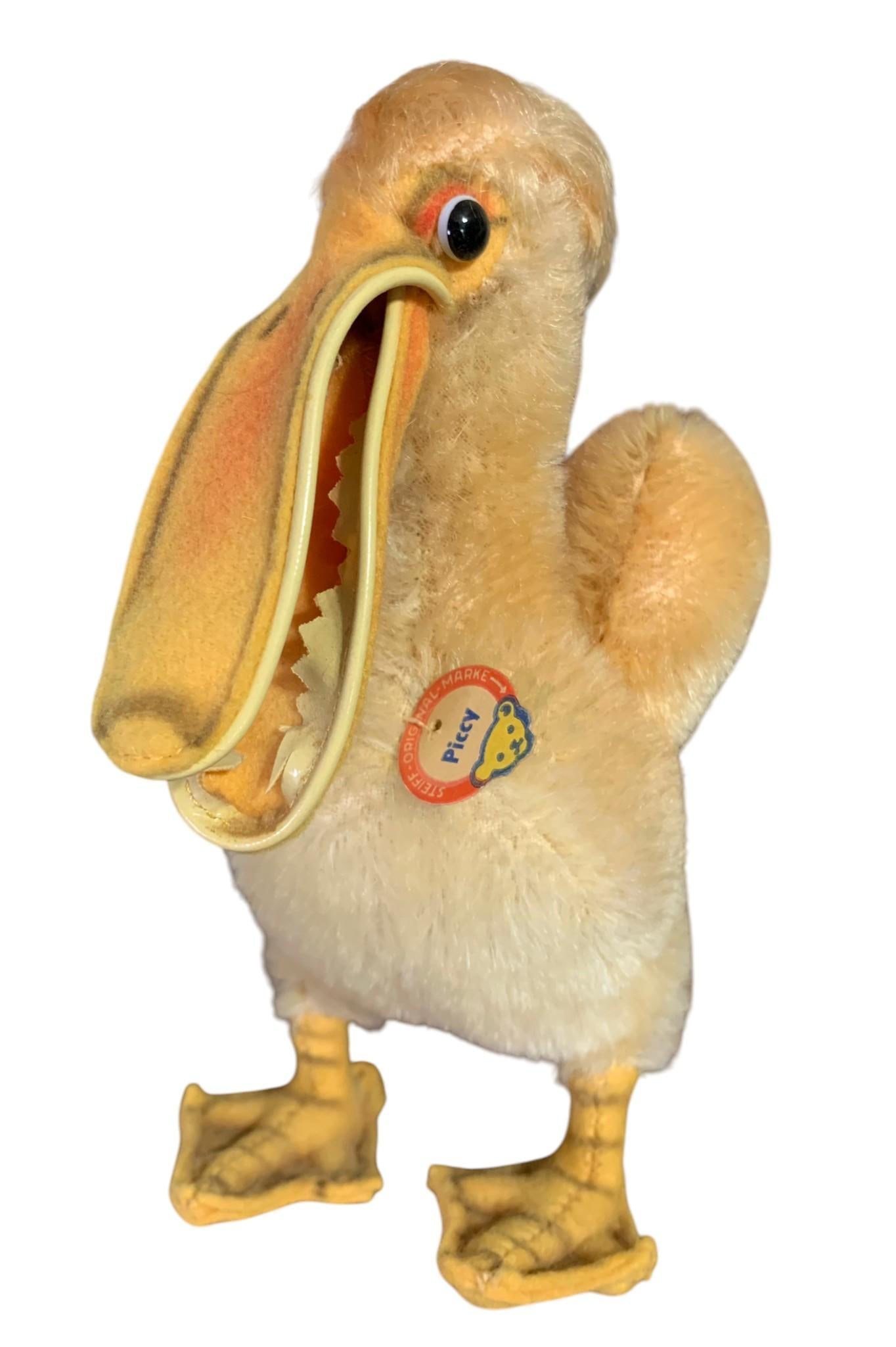 Vintage German STEIFF Wool Piccy the Pelican Stuffed Animal Toy with Tags: Fabric made in Germany tag on tail, paper tag on chest, 6 5/8" x 4" x 5", clean with vinyl zigzag teeth. 