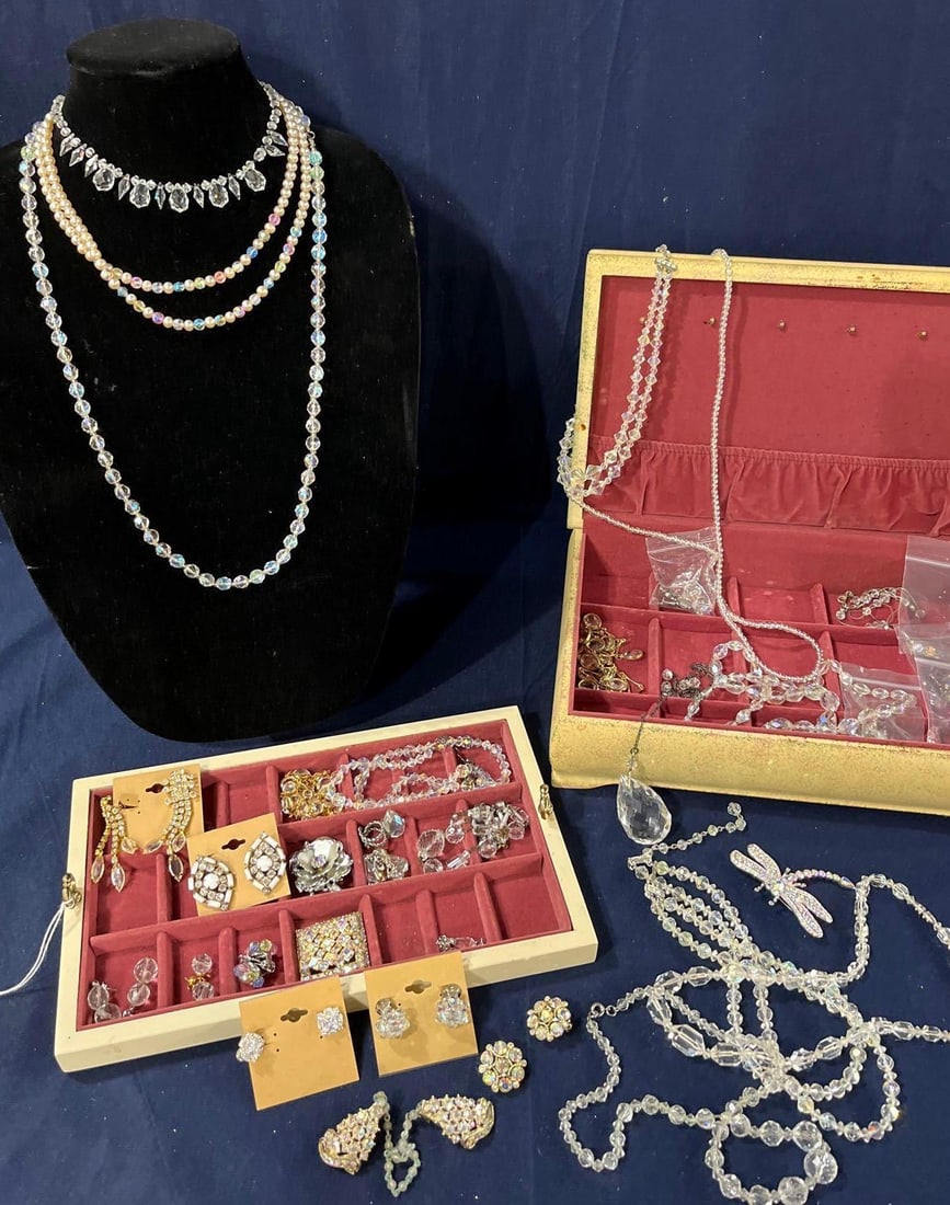 Crystal and Rhinestone Jewelry: 51 pieces including necklaces, earrings, bracelets, and brooches. Jewelry chest included.