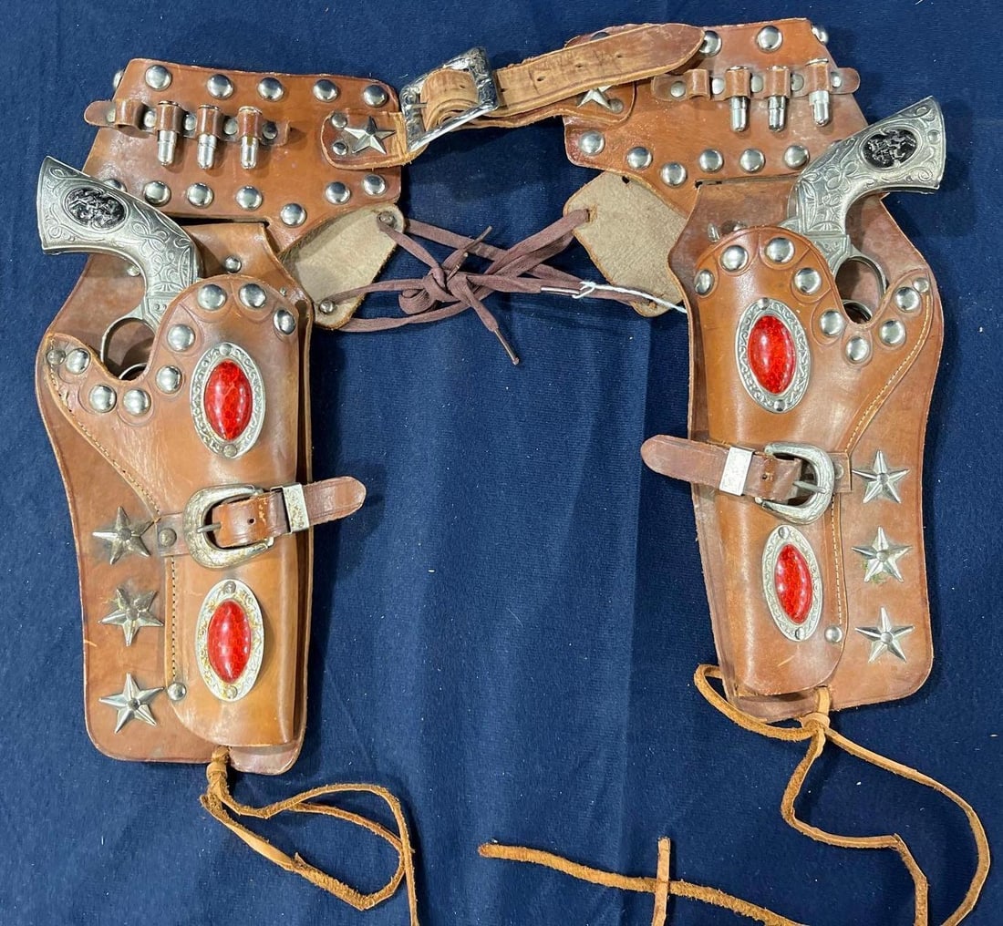 Deputy Hubley Cap Guns in Ornately Decorated Leather Holster: 1950s star studs with reflective medallions.