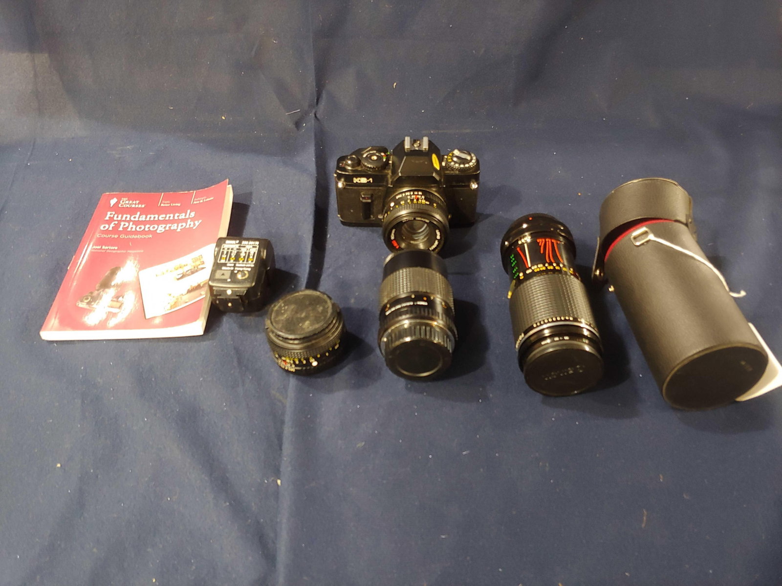 Sears KS-1 Camera and Lenses: Camera guide book, flashes, and several different lenses. Unknown of working status.