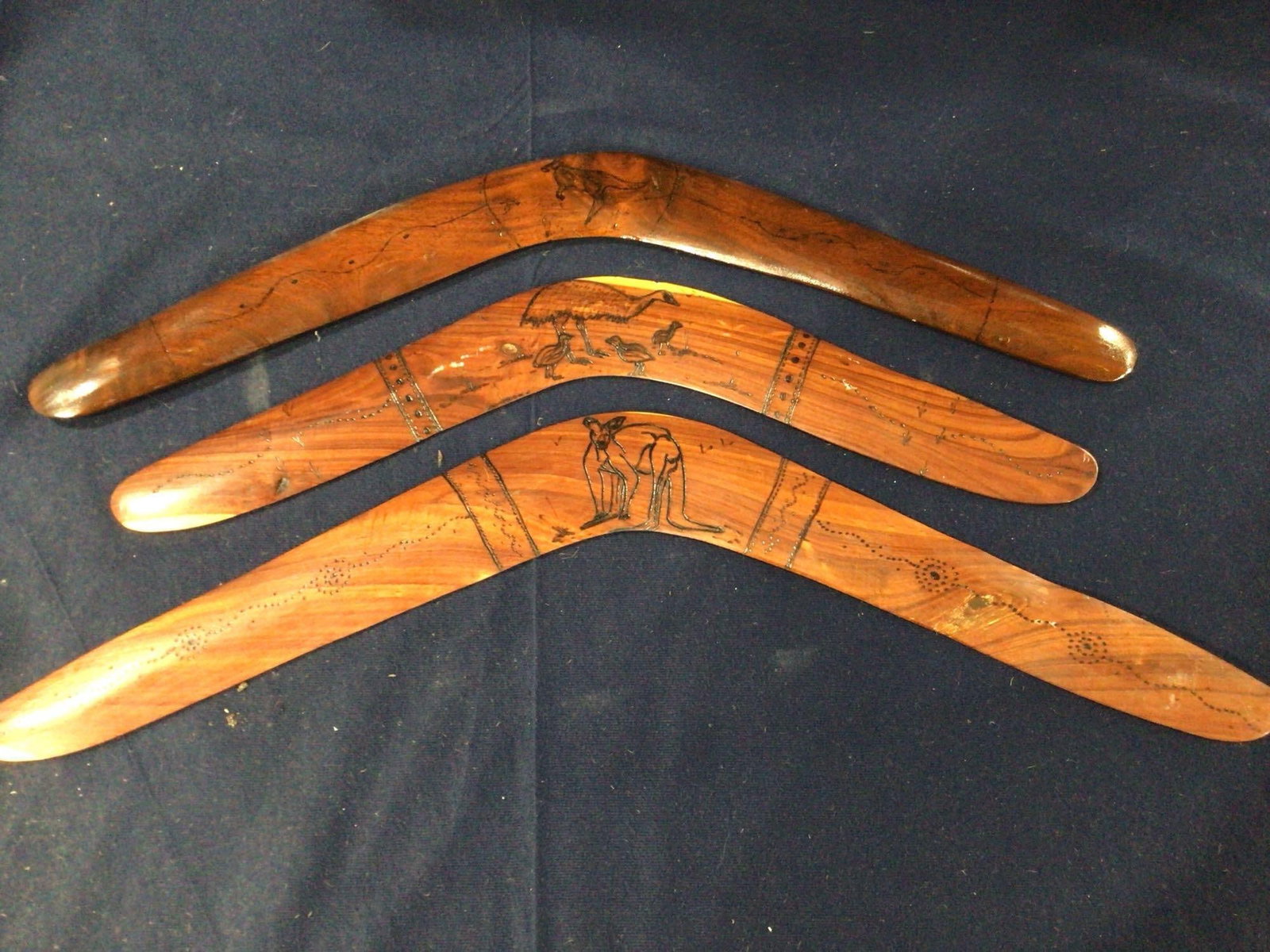 Wooden Signed Boomerangs: Made in Australia each with Wallaby and Emu carvings.