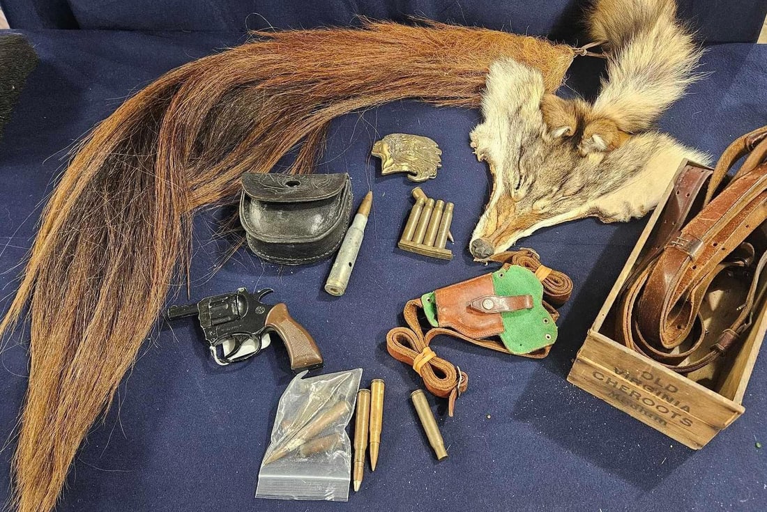 Hide, Tail, Weaponry, and Mountain Man Hunting Man lot: Leather sling with holster, Chief brass buckle, Vanguard Italian cap Gun, cheroots crate and great hunting items.