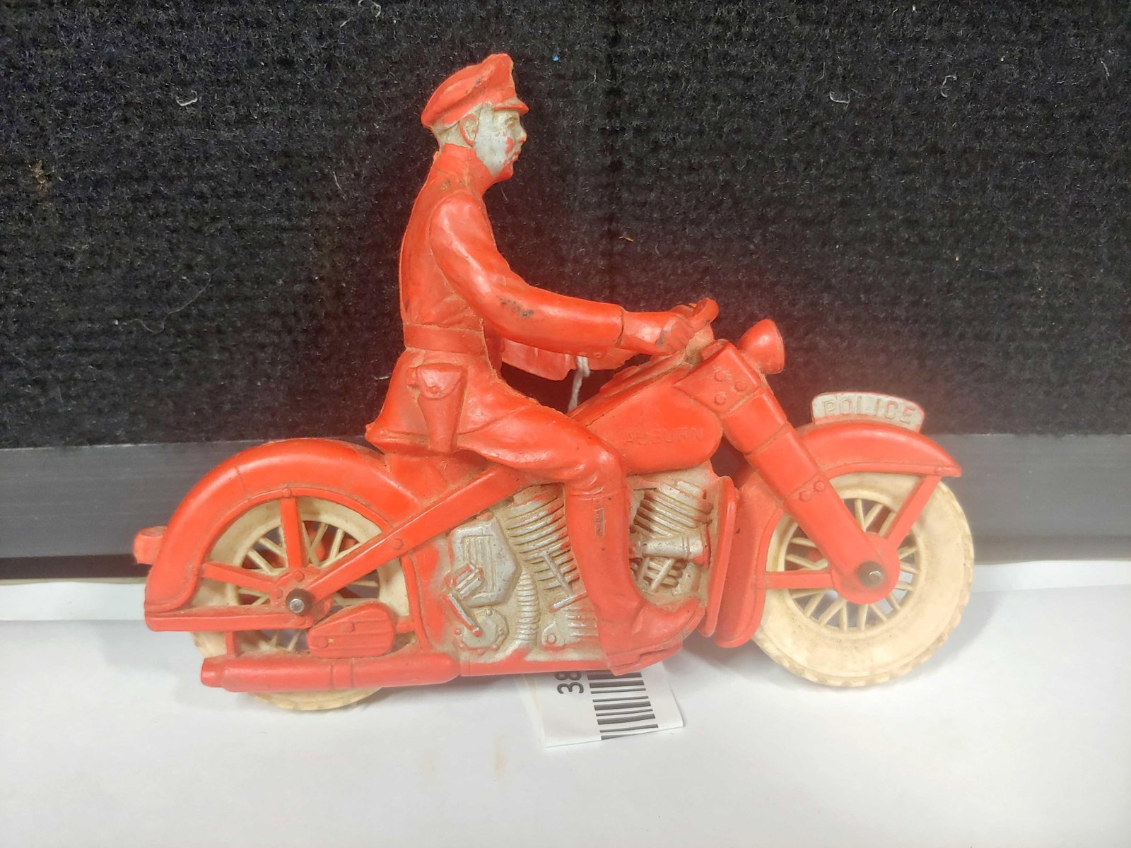 Auburn Rubber Police Motorcycle: 6x5, with some normal cracking due to age.