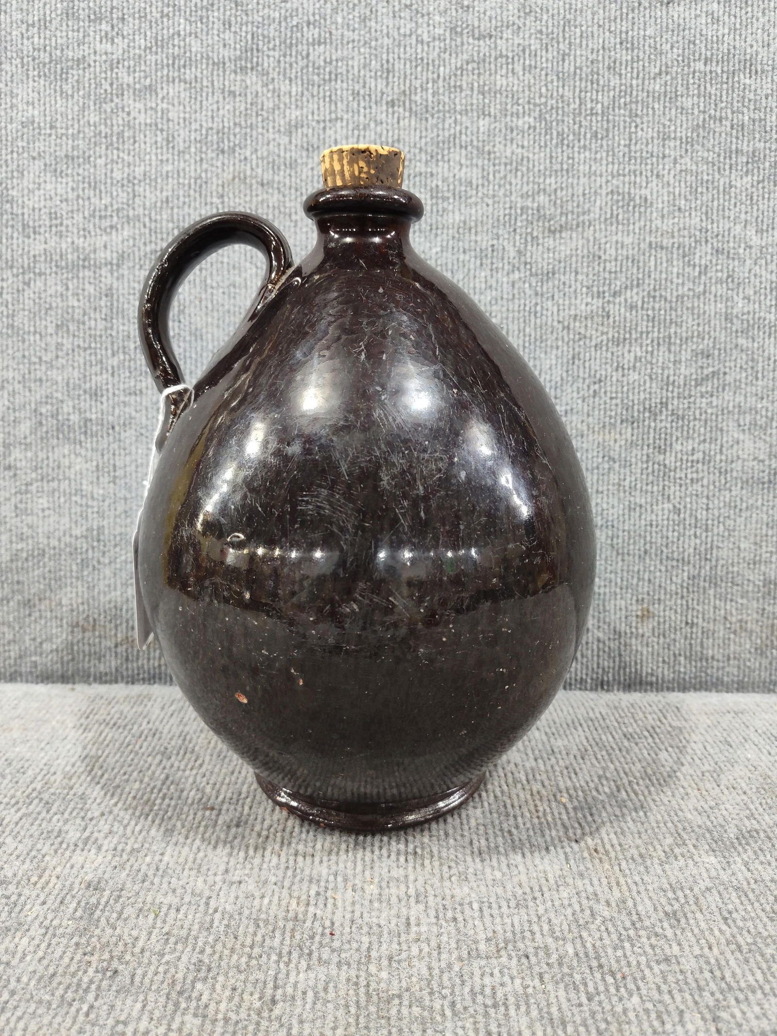 Great Redware Crock Jug: 10.5 inches tall with cork stopper. A few minor chips to bottom and one to top spout