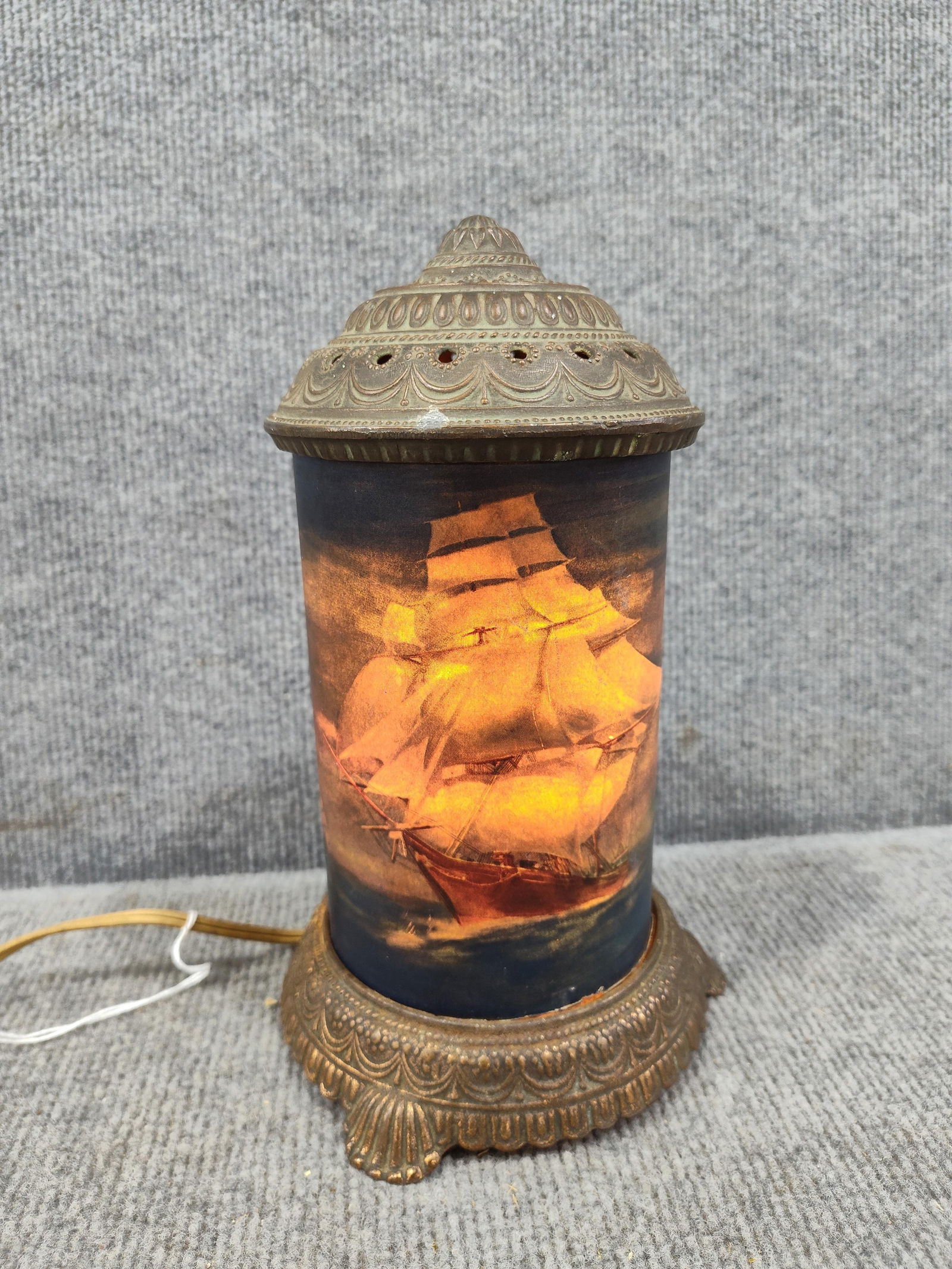 Motion Clipper Ship Light: Spinning mechanism is not working but this lights up. 9 inches tall. Awesome ship detail. Slight surface rust spots to base