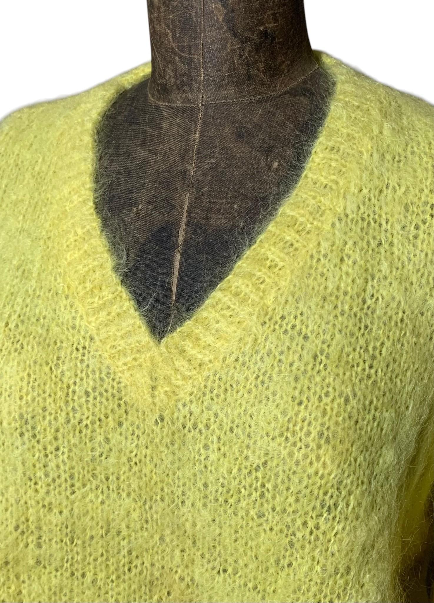 Mid Century Daffodil Yellow Knit Mohair Wool Blend Ladies V Neck Sweater: Luxurious wool yarn, great loft and body, even hue with faint discolorations along the storage folds, measuring approximately from the outside of the sweater, Unsoaked.Bust: 45"Hip: 40"Sleeve: