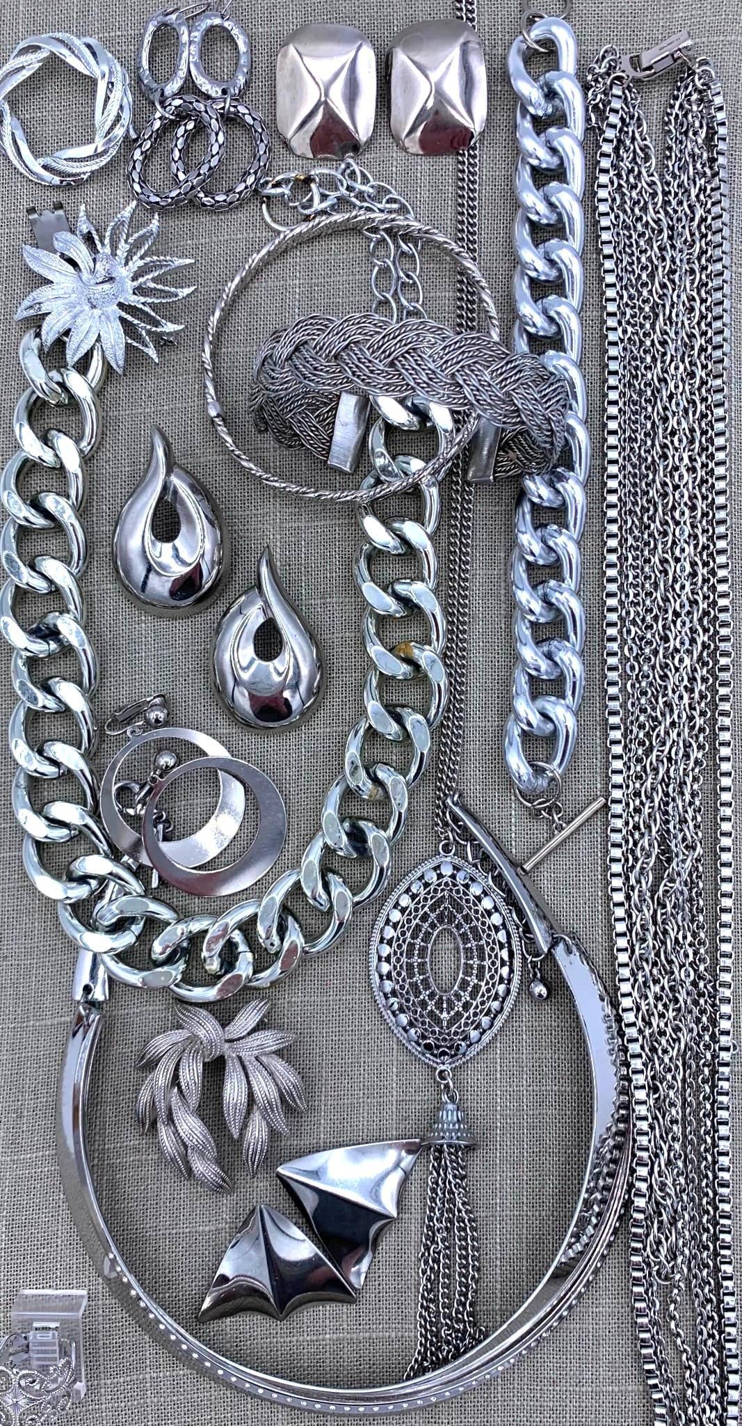 21 pc Vintage Glam Shining Silver Costume Jewelry Collection: Mid Century to 90s, with Sarah Cov, Trifari and Germany marked pieces, all with working closures, the pierced earrings will need post backs.