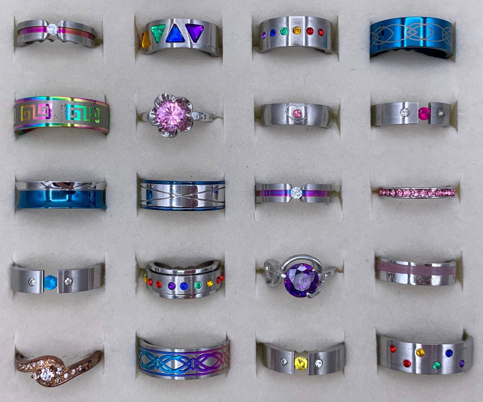 40 Sparkling Rainbow Hued Vibrant Costume Jewelry Fashion Rings: From size 14 to size 5, some engraved, etched, spinners, prong, tension or channel set with glittering stones.