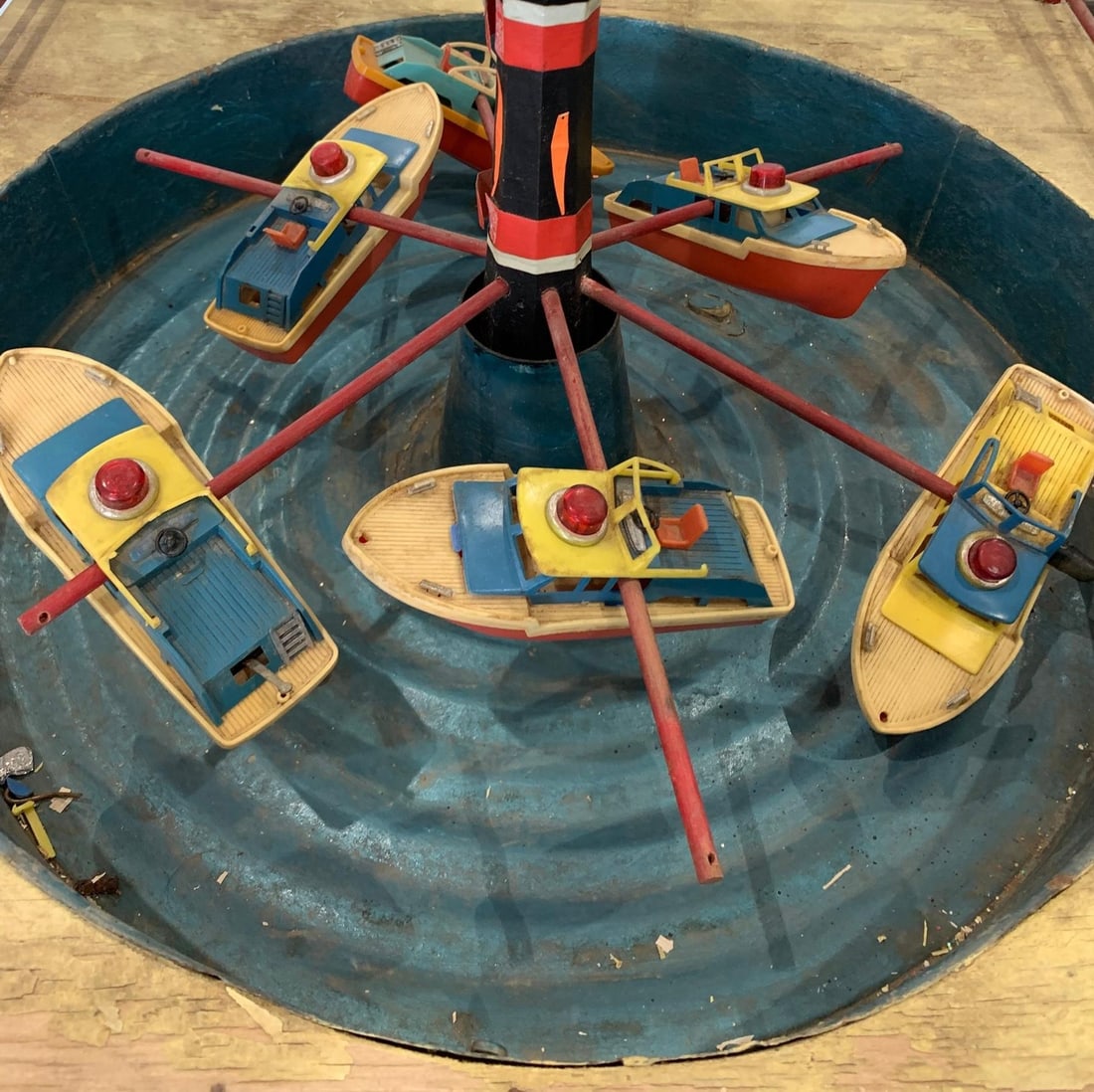 Unusual Vintage Carnival Boat Handmade Folk Art Novelty on Old Record Player: 28" x 23 1/2" x 17" with age and wear to the materials, hand crafted with a spinning metal water basin over a old record player motor, frayed early cord and wiring which will need replaced, colo