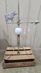 Lightning rod with cow weathervane