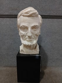 Plaster bust of Abraham Lincoln on wood base