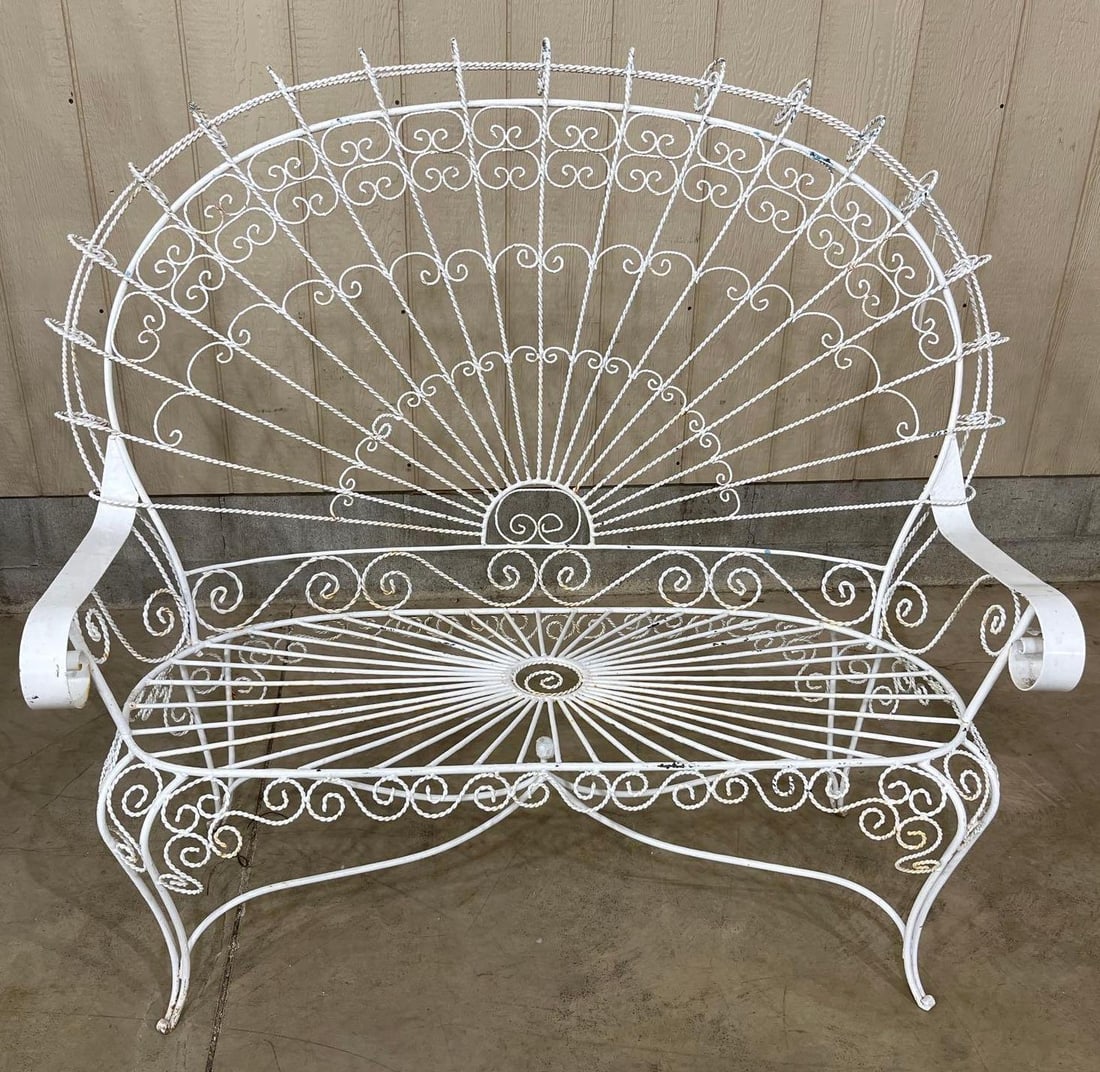 Wrought Iron Peacock Loveseat: 50.5in wide at arms 49in tall in back.