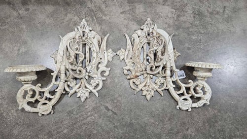 A pair of Fancy ornate cast iron wall sconces