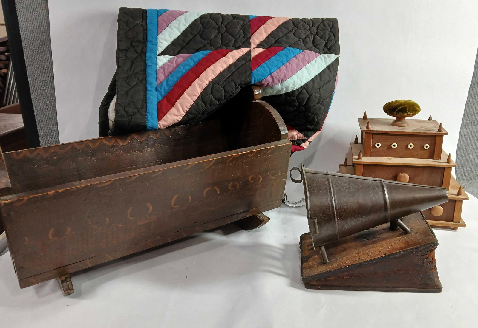 Hand Stitched Quilt, Cradle, Sewing Stand & Bellows: Great lot of early primitives. Doll quilt is clean with good stitching. Cradle has some decorative painted design.17 inches long. 