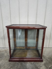 The Sun Mfg Co painted oak showcase