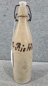 Signed German stoneware beer bottle