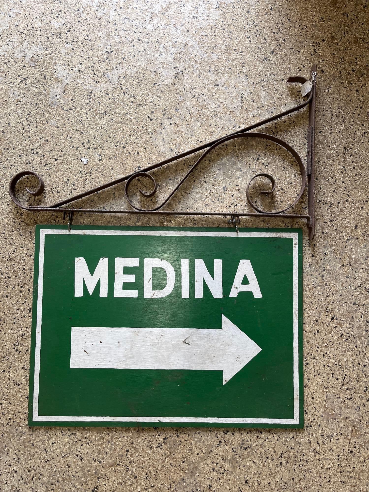 Medina Painted Wood Sign & Hanging Bracket: Single sided. 27.25x 20. Bracket has minor surface rust but is solid. 31x18.5