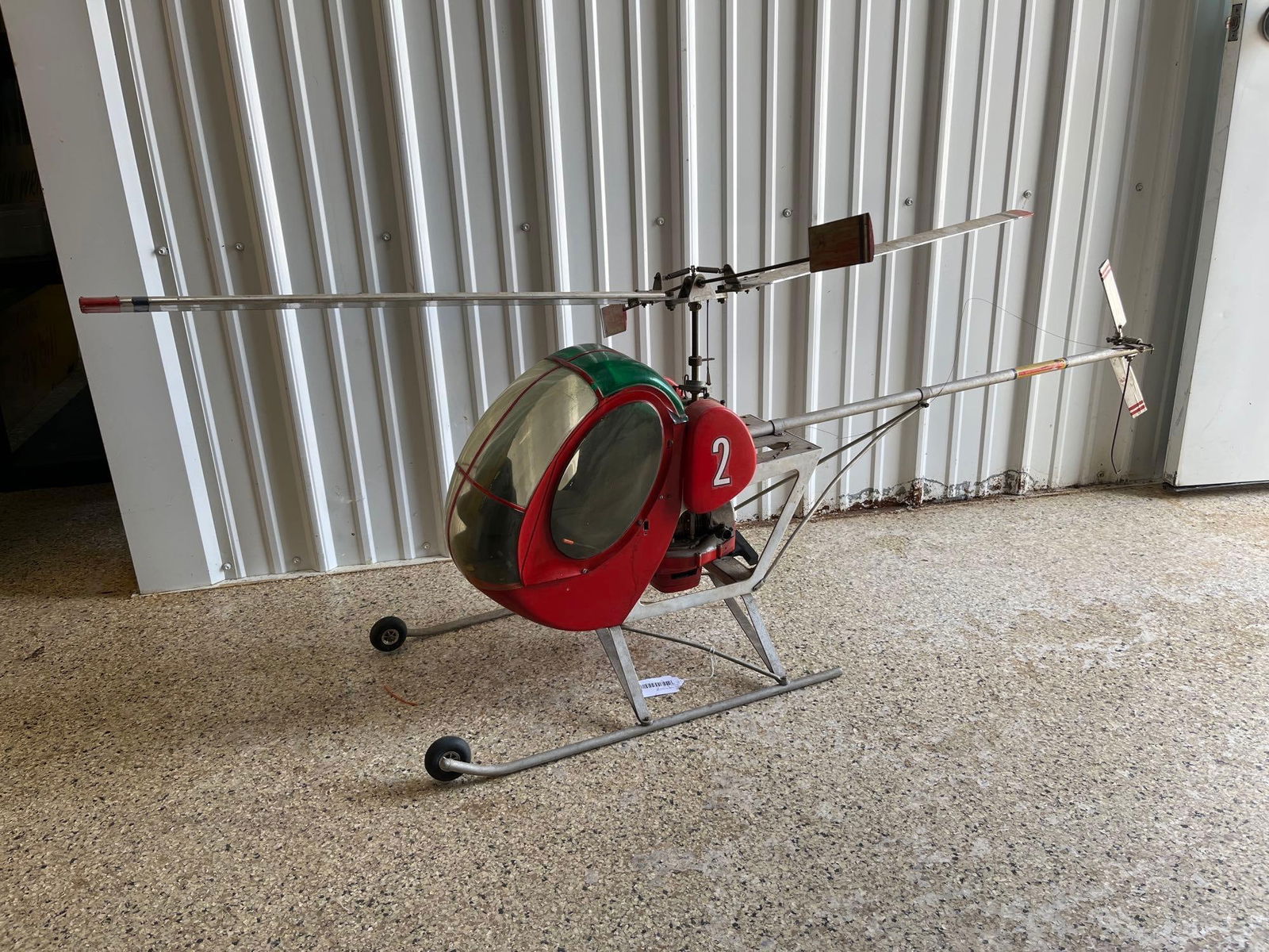 Model Hughes 300 Helicopter: Real pull start engine. Has not been tested but appears to have compression. Plastic windows with metal body. 56 inches long x 24x12.
